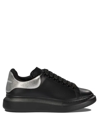 Alexander Mcqueen Black Low Top Sneakers With Metallic Heel Tab In Leather Man