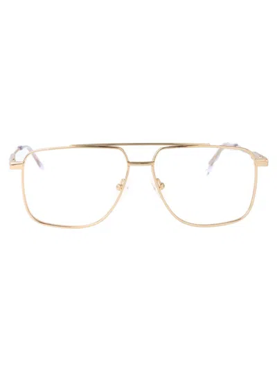 Alexander Mcqueen Am0480o Glasses In Gold-gold-transparent