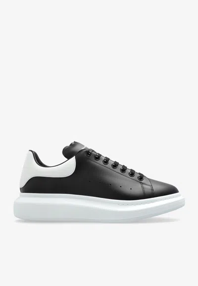 ALEXANDER MCQUEEN OVERSIZED LEATHER LOW-TOP SNEAKERS