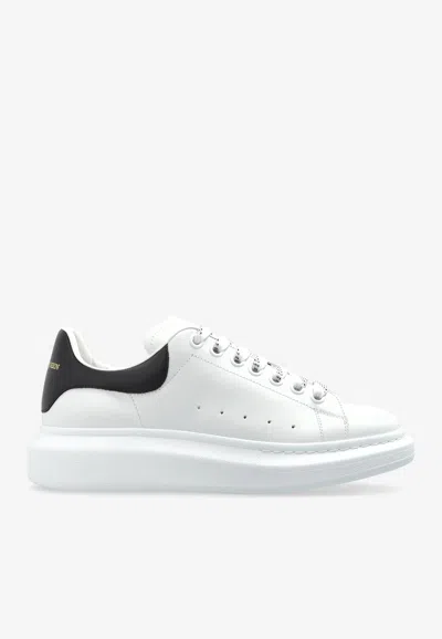 ALEXANDER MCQUEEN OVERSIZED LEATHER LOW-TOP SNEAKERS