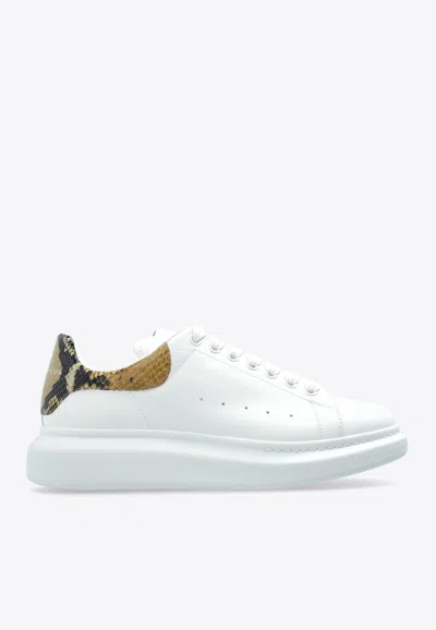 ALEXANDER MCQUEEN OVERSIZED LEATHER LOW-TOP SNEAKERS WITH SNAKESKIN PRINT HEEL