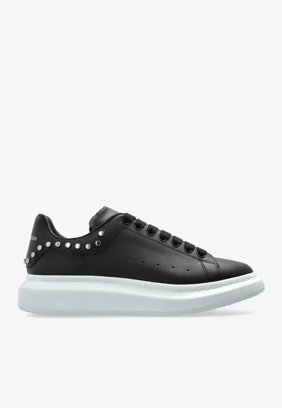 ALEXANDER MCQUEEN OVERSIZED LOW-TOP SNEAKERS WITH STUDS