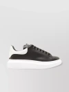ALEXANDER MCQUEEN OVERSIZED PERFORATED LEATHER SNEAKERS