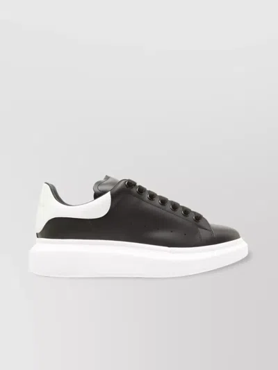 ALEXANDER MCQUEEN OVERSIZED PERFORATED LEATHER SNEAKERS