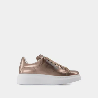 Alexander Mcqueen Oversized Lace-up Sneakers In Gold
