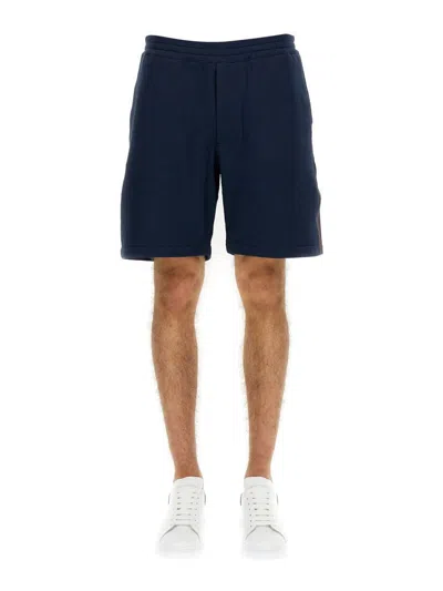 Alexander Mcqueen Men Bermuda Shorts With Selvedge Logo Band In Blue