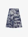 Alexander Mcqueen Graffiti Printed Bermuda Denim Shorts In Indigo