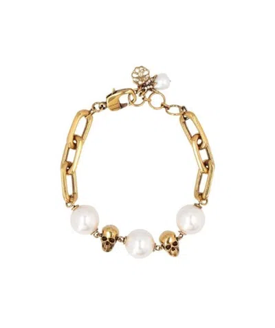 Alexander Mcqueen Pearl-embellished Skull Bracelet In Yellow