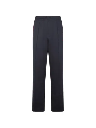 Alexander Mcqueen Piped Track Pants In Black