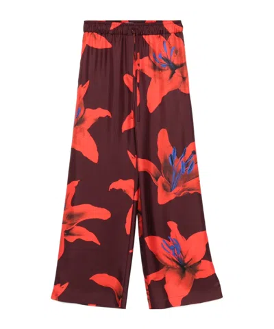 ALEXANDER MCQUEEN ALEXANDER MCQUEEN FLORAL PRINTED WIDE-LEG TROUSERS