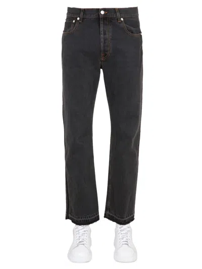 Alexander Mcqueen Raw Cut Jeans In Black