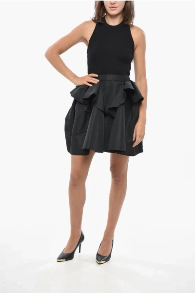 Alexander Mcqueen Ribbed Knitted Minidress With Flounced Skirt In Black