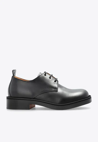 Alexander Mcqueen Skull-embossed Leather Derby Shoes In Black