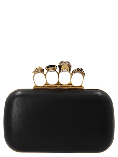 Alexander Mcqueen Skull Four Ring Clutch In Black