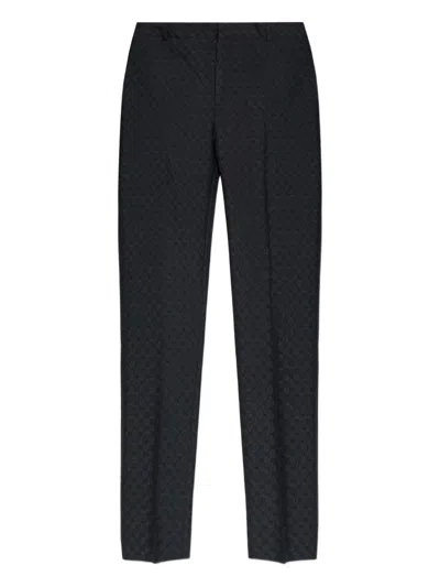 Alexander Mcqueen Skull-pattern Trousers In Black