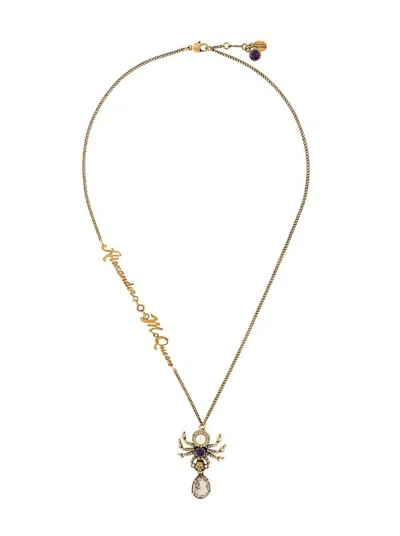 Alexander Mcqueen Spider Skull Pendant Necklace In Yellow