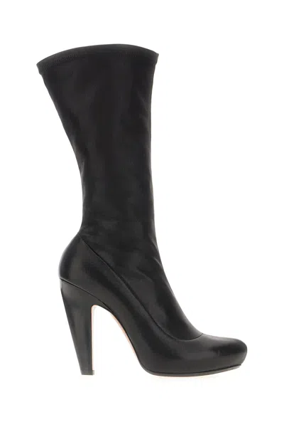 Alexander Mcqueen Closed Toe Knee Length Boots In Black