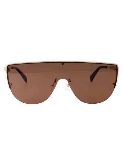 Alexander Mcqueen Sunglasses In Gold