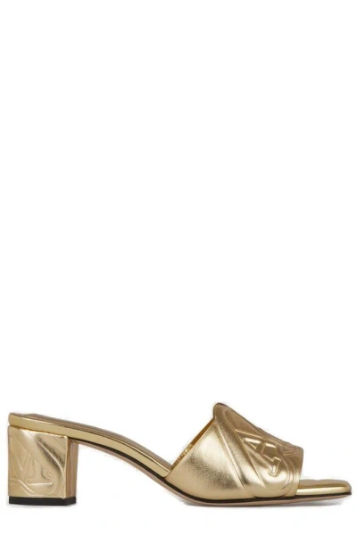 Alexander Mcqueen The Seal Emboosed Metallic Sandals In Gold