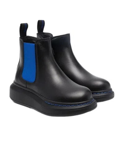 Alexander Mcqueen Thick-soled Jacketed Boots In Black
