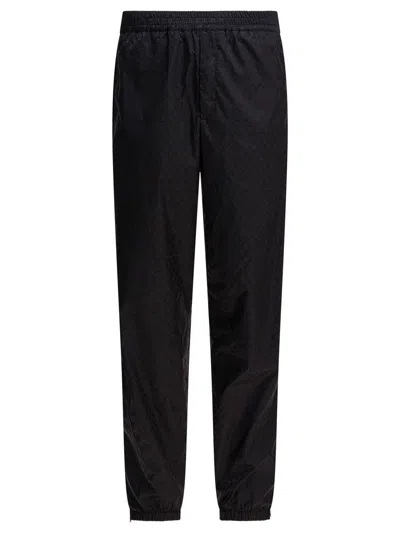 Alexander Mcqueen Patterned Trousers With Elastic Cuffs And Waistband In Black