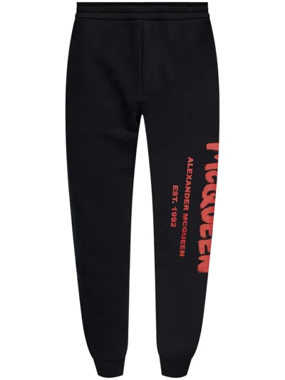 Alexander Mcqueen Mcqueen Graffiti Joggers In Black Lust Red