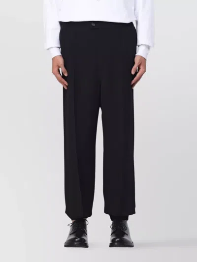 ALEXANDER MCQUEEN TROUSERS WITH PLEATED DESIGN AND POCKETS