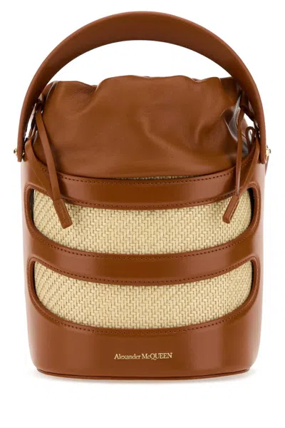 Alexander Mcqueen Two-tone Leather And Raffia The Rise Bucket Bag In Brown