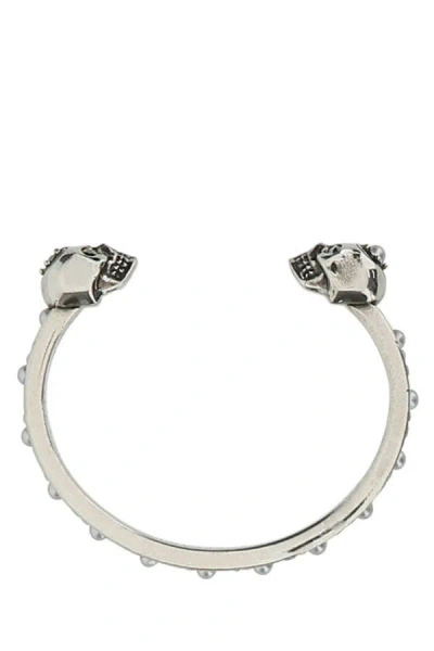 Alexander Mcqueen Woman Silver Metal Twin Skull Bracelet In Orange