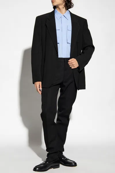 Alexander Mcqueen Wool Pleat-front Trousers In Black
