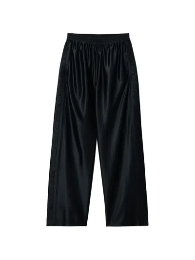 Alexander Wang Embossed-logo Track Pants In Black