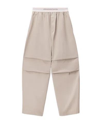 Alexander Wang Logo-elastic Pleated-knee Trousers In Neutral