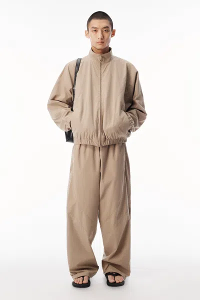 Alexander Wang Perforated Logo Mid-rise Track Pant In Dune
