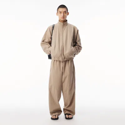 Alexander Wang Perforated Logo Mid-rise Track Pant In Sand