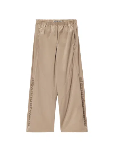Alexander Wang Perforated Logo Mid-rise Track Pants In Neutral