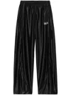 Alexander Wang Embossed Logo Track Pants In Nude In Black