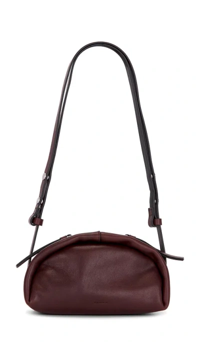 Allsaints Rosalie Arc Crossbody Bag In Burgundy Red