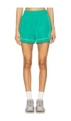 Alo Yoga Motivate Track Short In Green