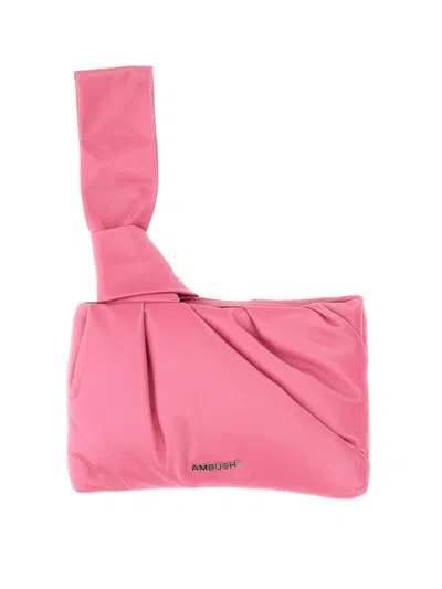 Ambush Designer Handbags Nejiri Wrist Clutch In Rose