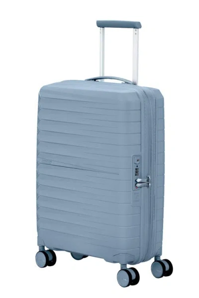 American Tourister Fastfoward Expandable Hardside 22" Carry On Spinner In Blue