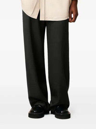 Ami Alexandre Mattiussi Elasticated Patch-pocket Trousers In Black