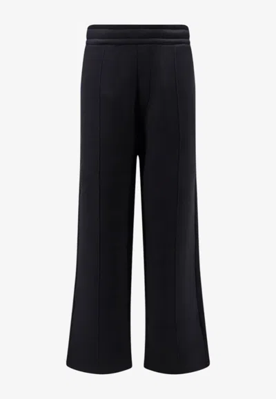 Ami Alexandre Mattiussi Embossed Logo Wide-leg Pants In Black