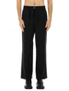 Ami Alexandre Mattiussi Ami Paris Men Black Pants With Elastic Waist With Drawstring In Virgin Wool Man In Black