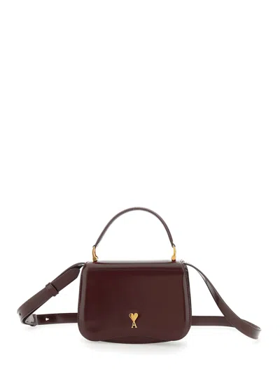 AMI ALEXANDRE MATTIUSSI BORDEAUX HANDBAG WITH ADC PATCH ON THE FRONT AND ADJUSTABLE AND REMOVABLE SHOULDER STRAP IN LEATHER 