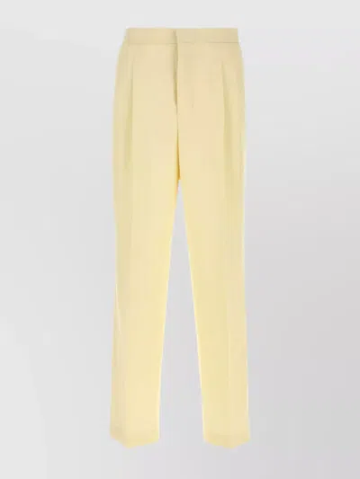 AMI ALEXANDRE MATTIUSSI WOOL TROUSERS WITH BACK POCKETS AND PLEATED DESIGN