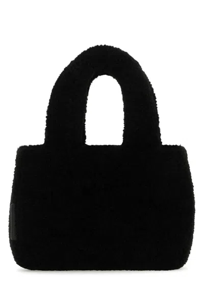 Amina Muaddi Shearling Handbag With Twin Handles And Structured Silhouette In Black