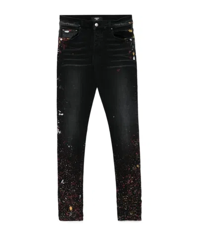 AMIRI AMIRI PAINT SPLATTER PRINTED JEANS