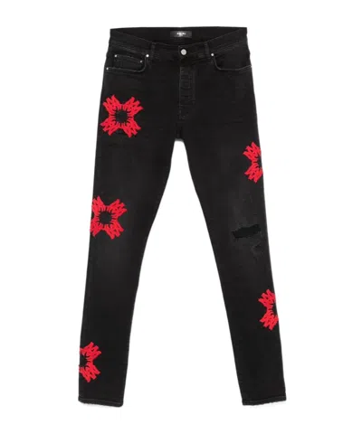 AMIRI AMIRI MA QUAD-APPLIQUÉ SKINNY JEANS