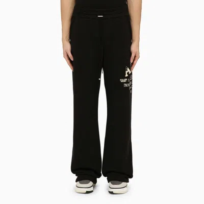 AMIRI BLACK COTTON JOGGING TROUSERS FOR MEN WITH SIDE LOGO PRINT AND LEATHER LABEL