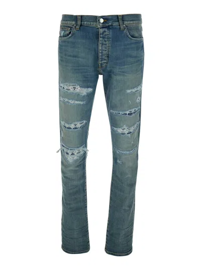 AMIRI BLUE 'MA QUAND' JEANS WITH RIPPED DETAILS ON THE FRONT AND LOGO PATCH ON THE REAR IN DENIM MAN